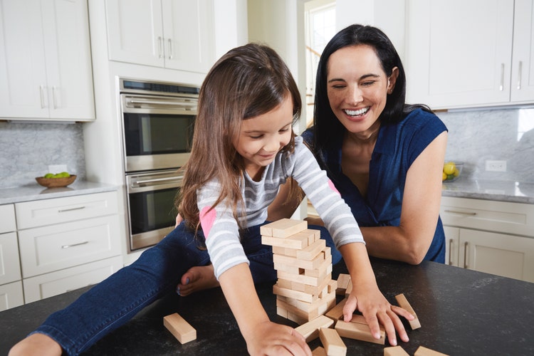 family-playing-and-enjoying-air-quality-of-home-with-ductless-system
